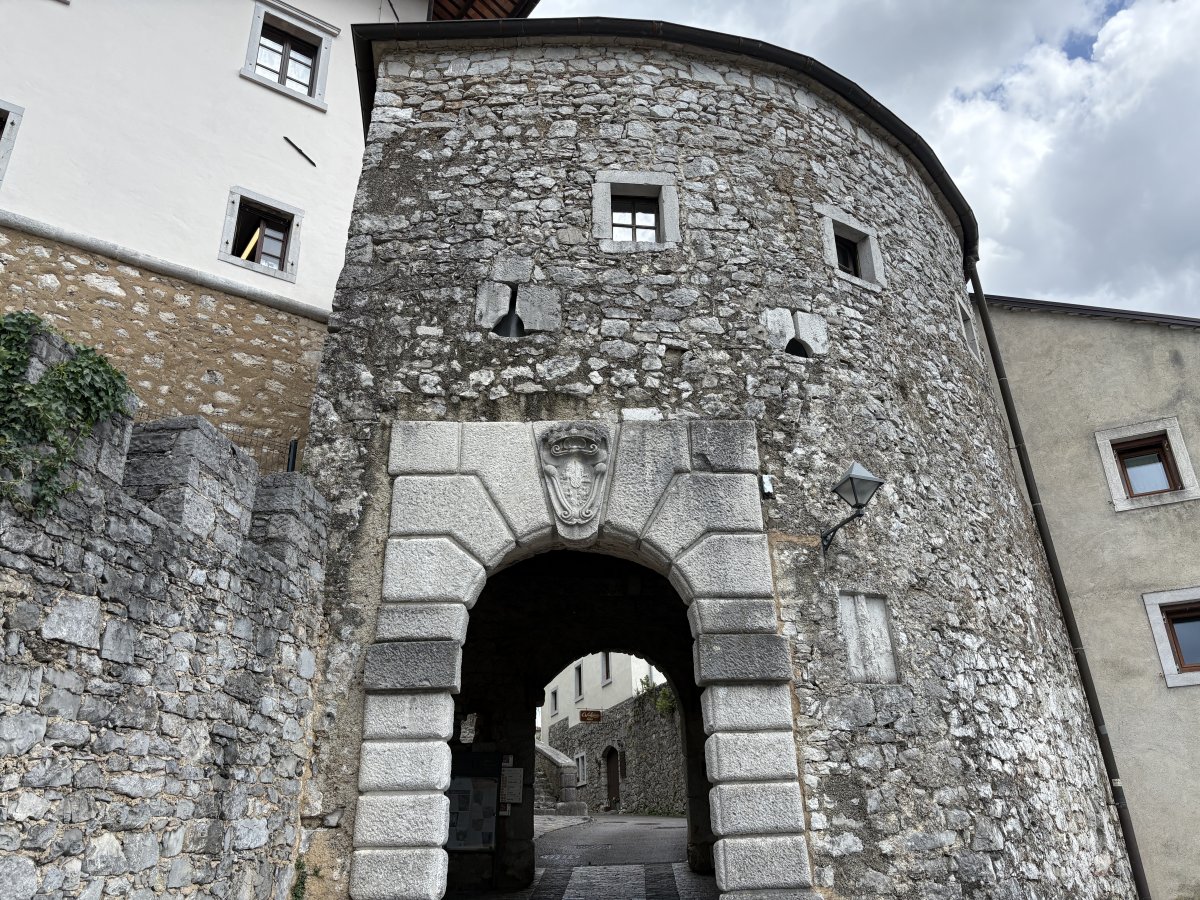 The village was well fortified with castle walls, towers and this big gate..