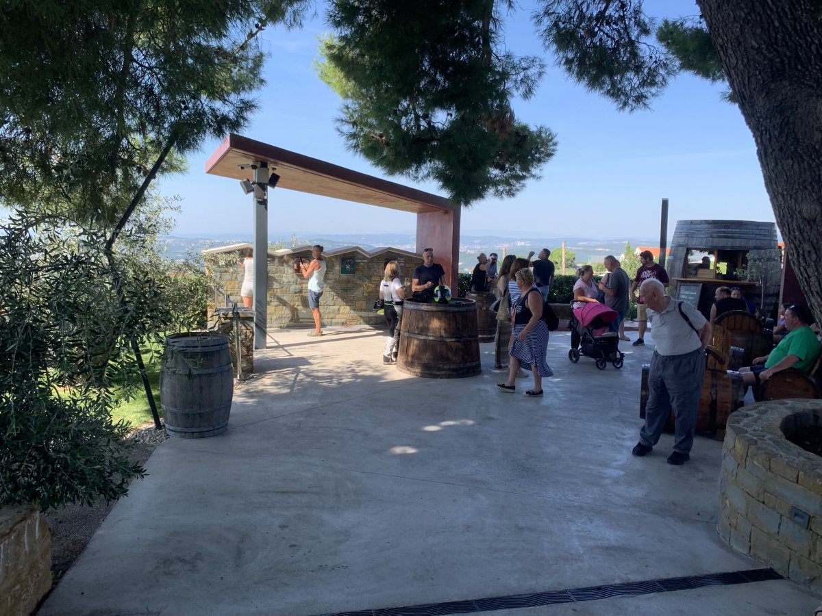 Get your wine at the wine fountain and pick up your Slovenian Tapas at the big wine barrel on the right..