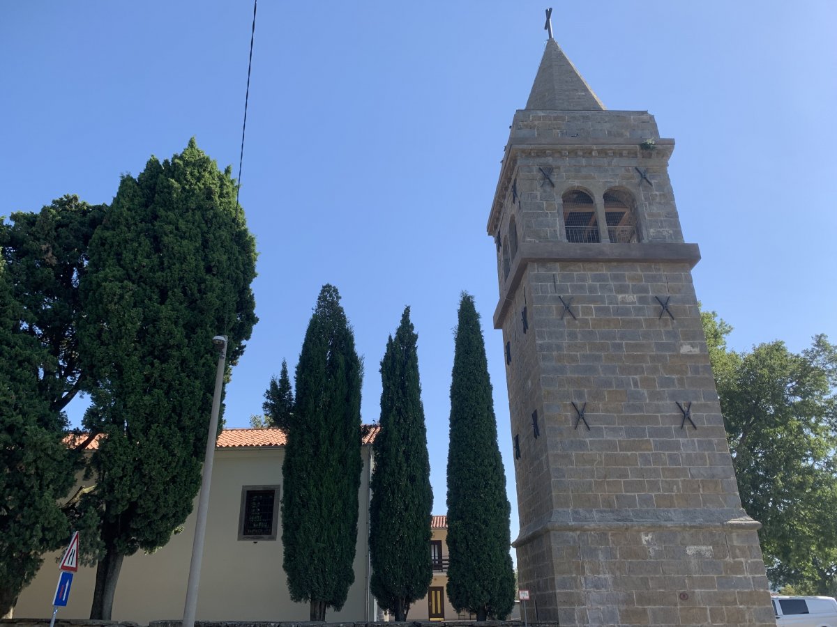 Lollipop trees next to the lovely church tower..