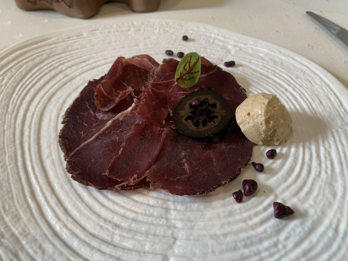 Bear prosciutto, porcini mushroom ice cream, black walnut and blackcurrant starter at Mahorcic..