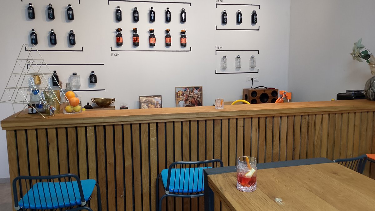 A glass of home made Brkini Gin and the bar at Brin Gin, Rodik..