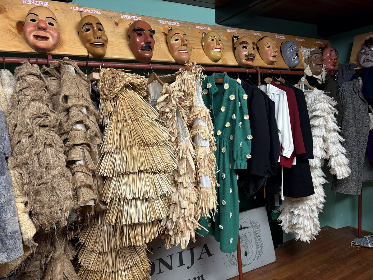 the Masks and Costumes are lined up like in a football dressing room, ready for the team to come in and get changed..