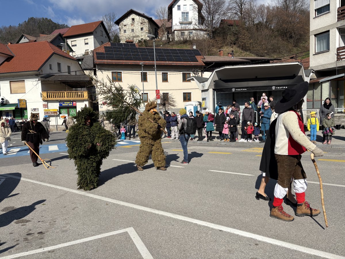 Pust carries his tree with his brother, the Spruce Man next to him..