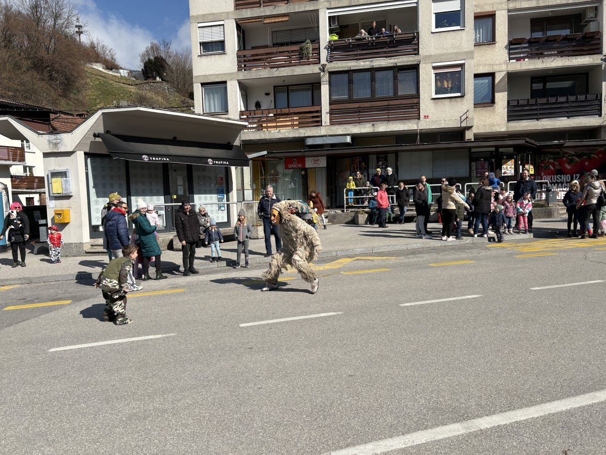 a White Ghost chases a little boy, the kids absolutely love antagonizing the 3 Policemen of the carnival..
