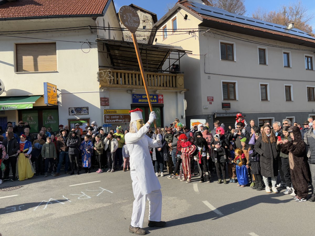 the Baker always leads the procession with his Bread Paddle raised high..