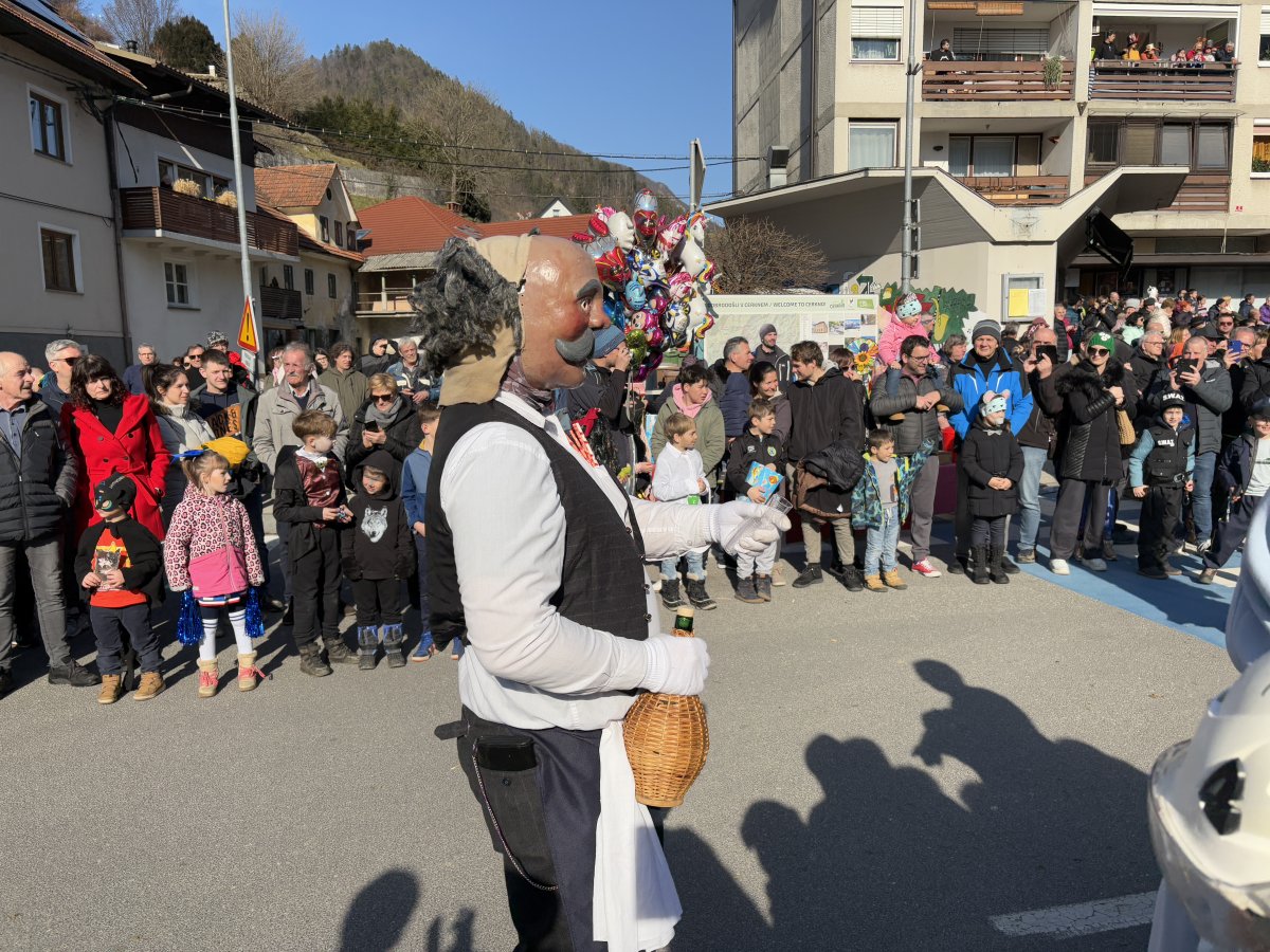 the Bar owner wanders around at the end of the procession..