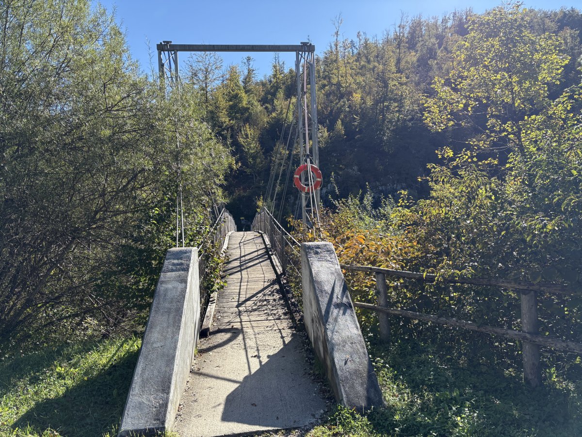Cross the bridge over the Sava Bohinka river to reach the path on the other side and go right..